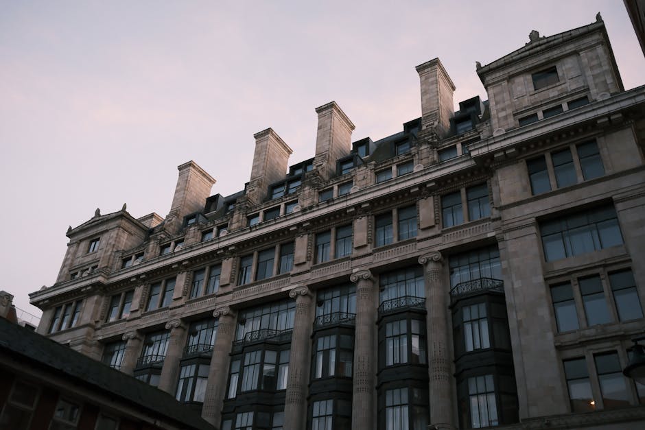 Stunning view of a classic stone building facade at dusk with a clear sky
