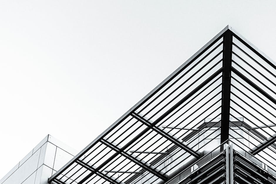 Low angle shot of a modern building with steel and glass design
